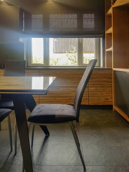 Roman blind in the interior of modern kitchen