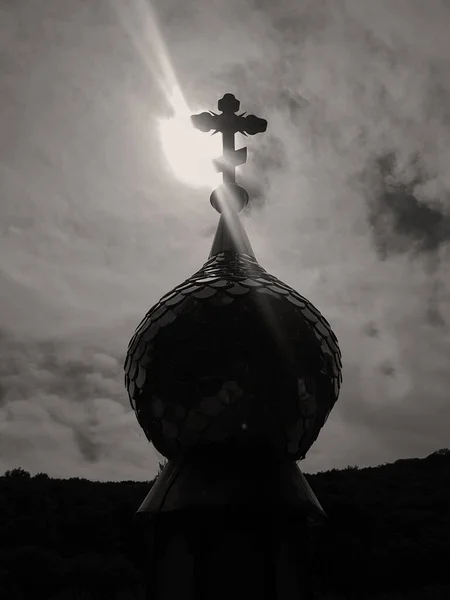 dome with a cross on the background of a sunny sky