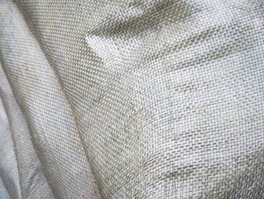 kabaca dokunmuş sentetik kumaş dokusu arka planının makro görünümü