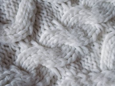 Sıcak kış arkaplanı için tıknaz beyaz kablo yün dokusunun tam çerçevesi