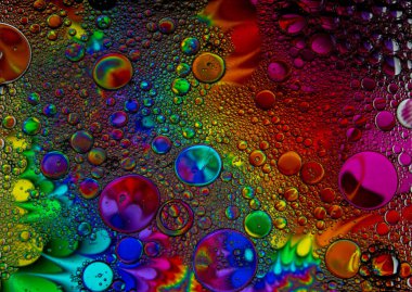 Soyut renkli kabarcıklar. Renk tozunun hareketsiz hareketi sıçrar. Arkaplan resmi.