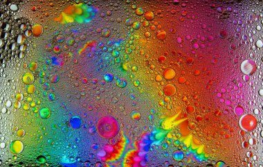 Soyut renkli kabarcıklar. Renk tozunun hareketsiz hareketi sıçrar. Arkaplan resmi.