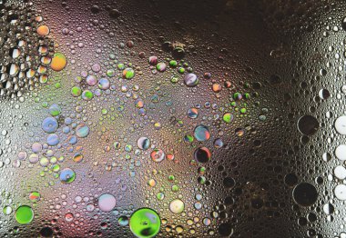 Soyut renkli kabarcıklar. Renk tozunun hareketsiz hareketi sıçrar. Arkaplan resmi.