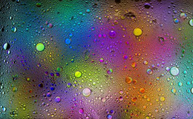 Soyut renkli kabarcıklar. Renk tozunun hareketsiz hareketi sıçrar. Arkaplan resmi.