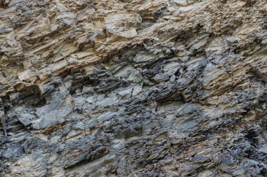 Pürüzsüz bir kayanın dış yüzeyiyle yüzünün tüm dokuları..