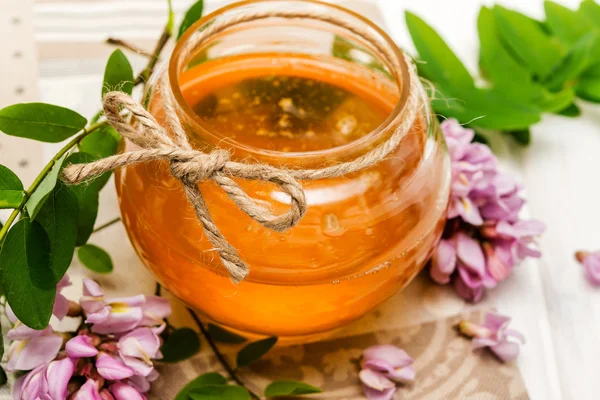 Acacia honey and flowers — Stock Photo, Image