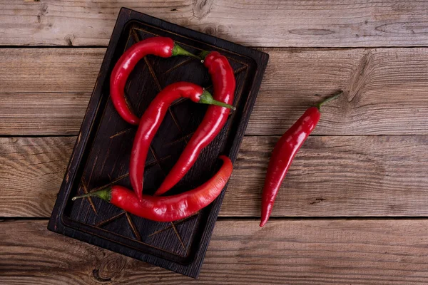 Red Hot Chili Pepper Wooden Background — Stock Photo, Image