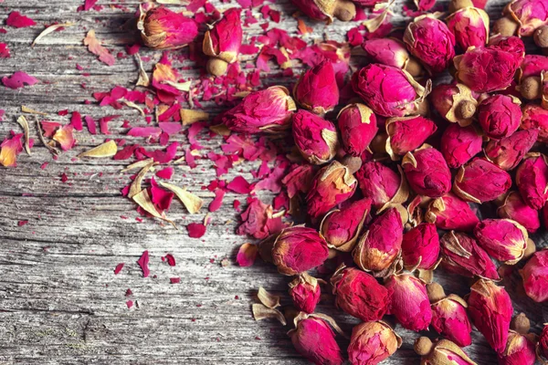 Frame with dried  rose petals and buds