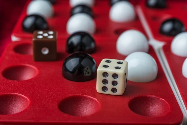 Black and white balls and bones on the wells — Stock Photo, Image