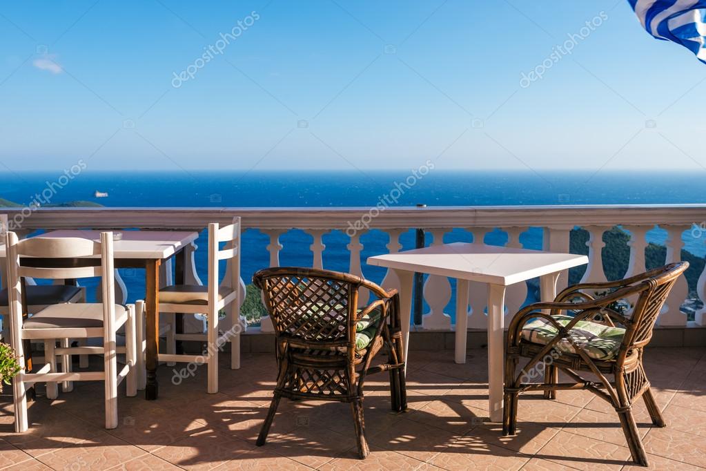 Small Greek Cafe Corfu Stock Photo Olenapavlovich 81894578 White Tables With Chairs And Greek Flag L In Romantic Bay On Sunny Day Corfu Greece Photo By Olenapavlovich