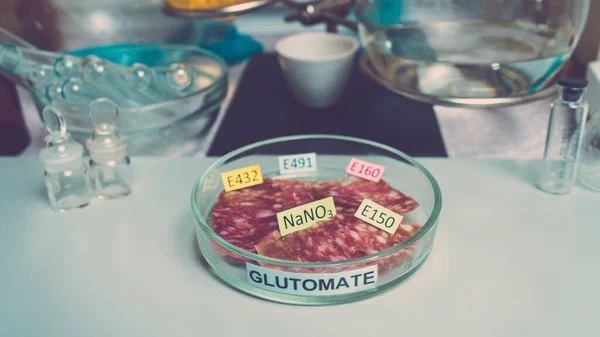 Photo food additives in sausages. Flavor enhancers and nitrates. Unhealthy food concept.