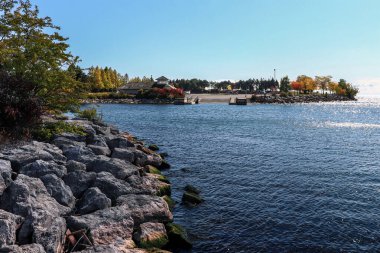 On the rocks near the lake on a Fall day, ON, Canada