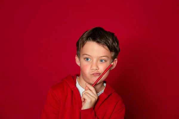 Cool Young School Boy Posing Red Pencil Ront Red Background — Stock Photo, Image