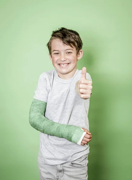 Cool Young Schoolboy Broken Arm Green Arm Plaster Posing Front — Stock Photo, Image