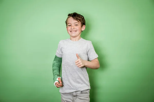 Cool Young Schoolboy Broken Arm Green Arm Plaster Posing Front — Stock Photo, Image