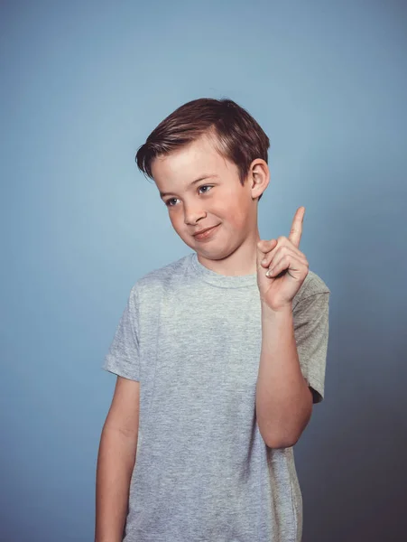 Cool Young Boy Grey Shirt Posing Front Blue Background Studio — Stock Photo, Image