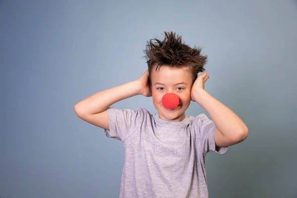 Cool Boy Wild Hair Posing Red Clown Nose Blue Background — Stock Photo, Image
