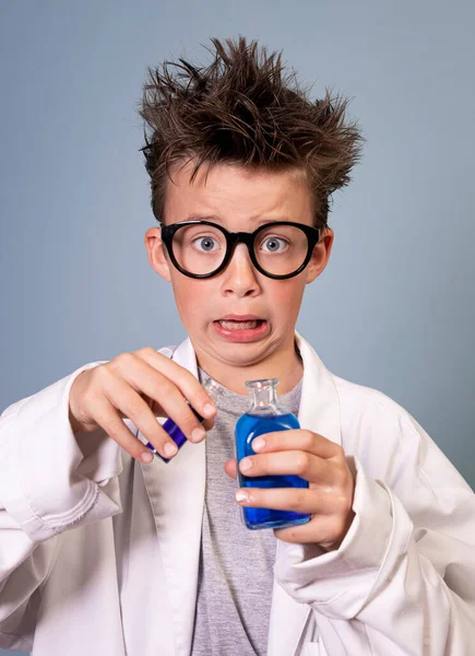 Cool Boy Wild Hair White Coat Holds Small Bottle Blue — Stock Photo, Image