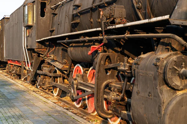 Old steam engine train and parts close-up