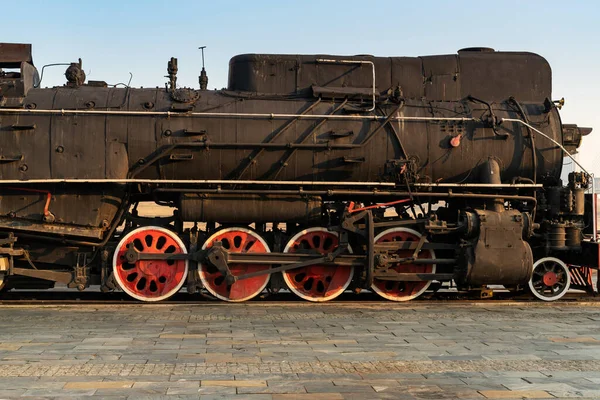 Old steam engine train and parts close-up