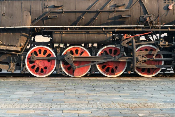 Old steam engine train and parts close-up