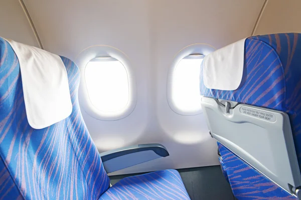 Empty aircraft seats and windows — Stock Photo, Image
