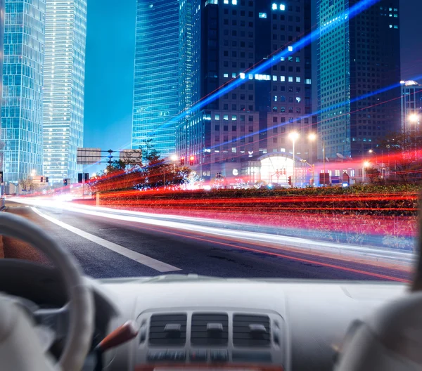 Driver's hands on steering wheel of car — Stock Photo, Image