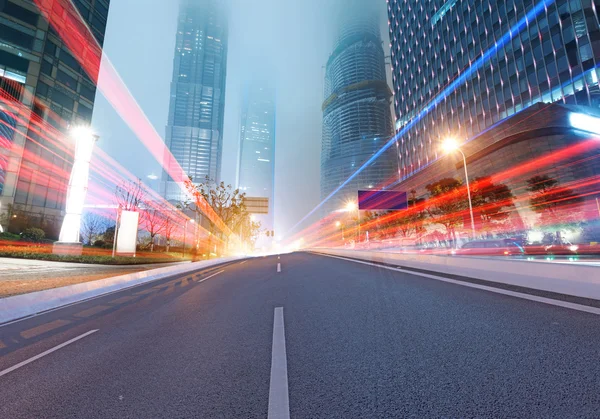 Asphalt road and modern city — Stock Photo, Image