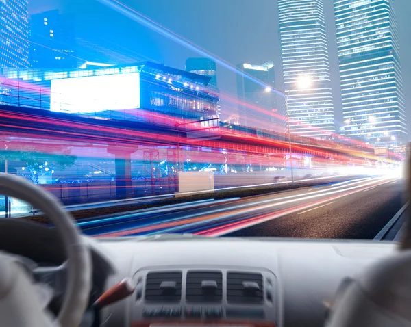 Driver's hands on steering wheel of car — Stock Photo, Image