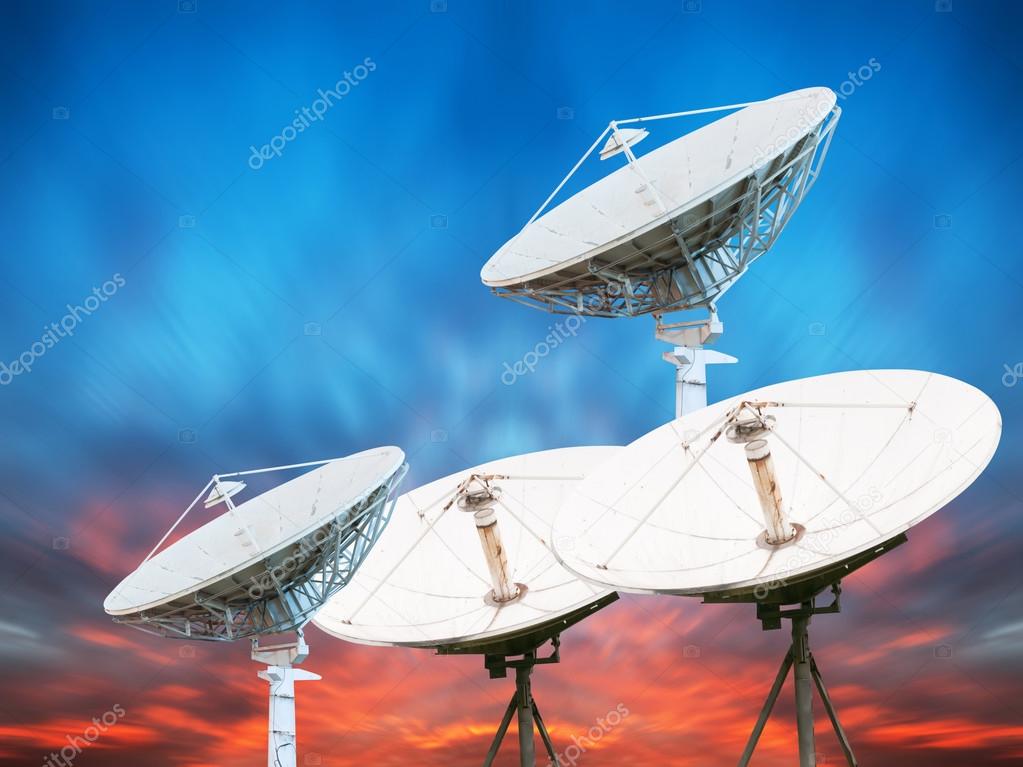 Satellite dish antennas under sky