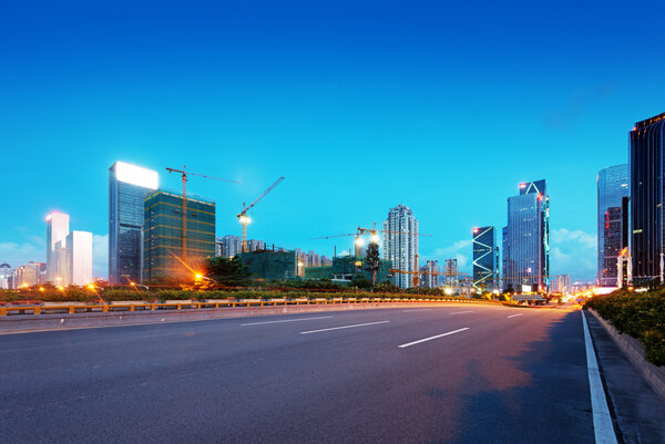 Light trails on street at dusk