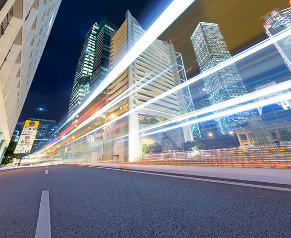 Asphalt road and modern city — Stock Photo, Image