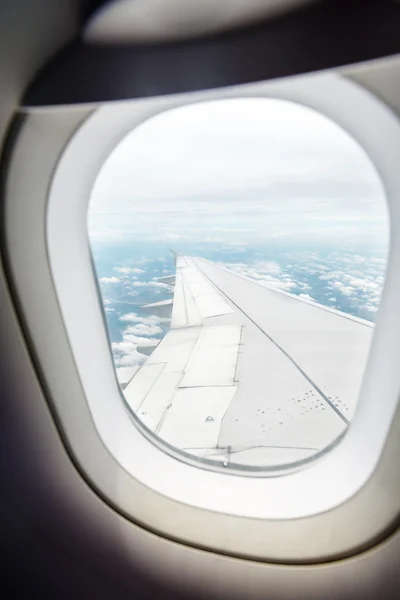 Sky through window of an aircraft — Stock Photo, Image