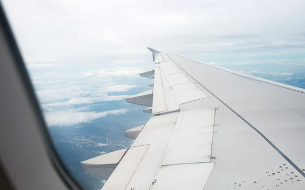 Sky through window of an aircraft — Stock Photo, Image