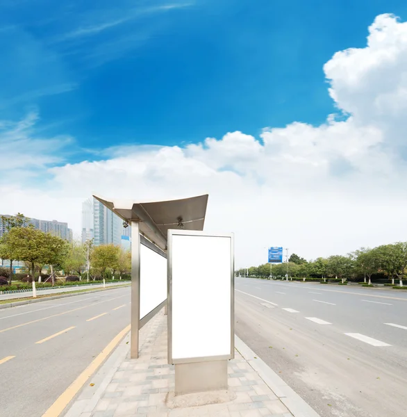 Bus stop with billboard — Stock Photo, Image