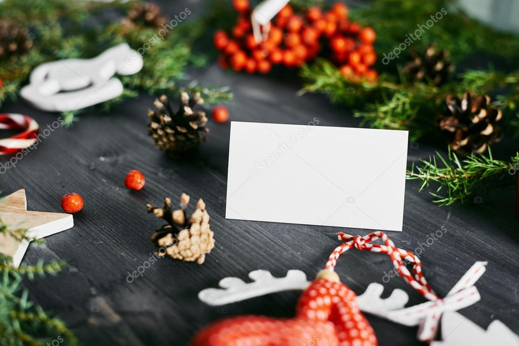Blank business card on a Christmas wooden background.