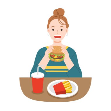 Patates kızartması ve soda ile hamburger yiyen genç kadınlar. Ömür boyu fast food. Sağlıksız gıda konsepti.