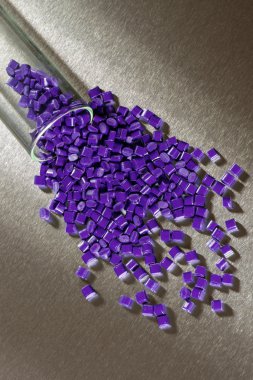 Purple Polymer Granulate on stainless steel sheet clipart