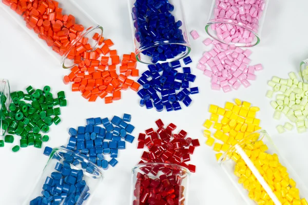 Test glasses with dyed polymer resins on white — Stock Photo, Image