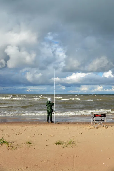 Fisherman at coast — Stock Photo, Image