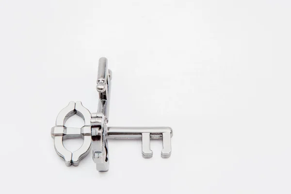 Metal puzzle key — Stock Photo, Image