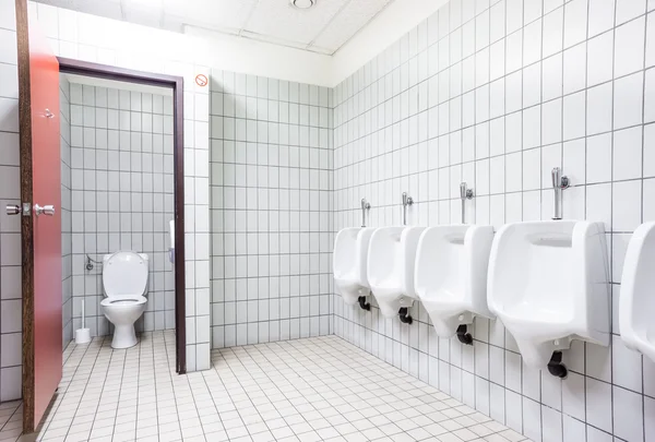 Urinal and toilet doors — Stock Photo, Image