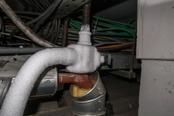 heating pipes are frozen with a freezer to work on the pipes