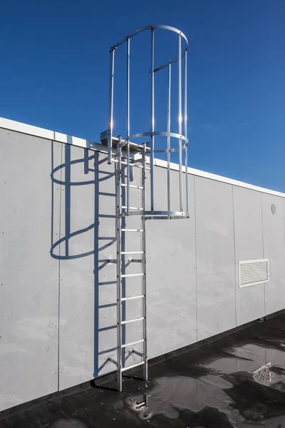 on an roof of an building there is an emergency staircase