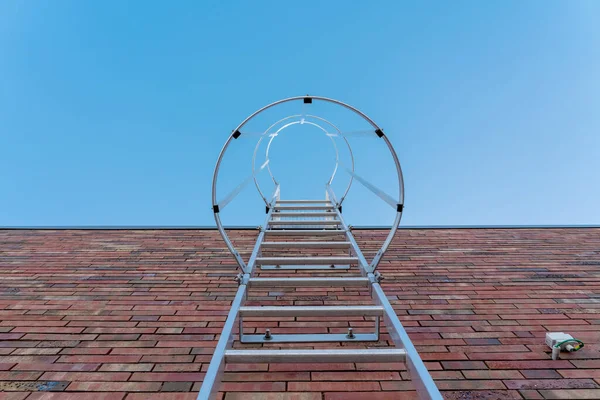 on an roof of an building there is an emergency staircase