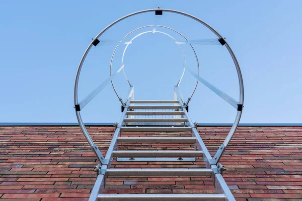 on an roof of an building there is an emergency staircase