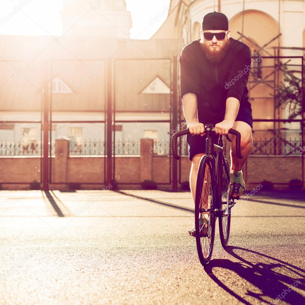 man riding on fixed gear bike