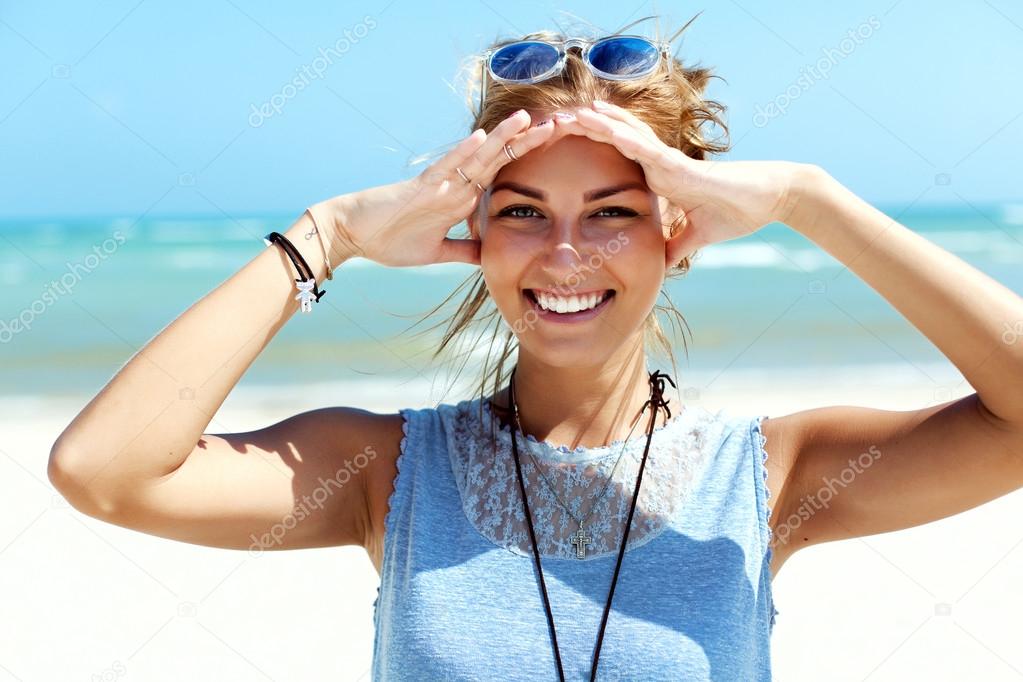 young smiling woman  on ocean beach