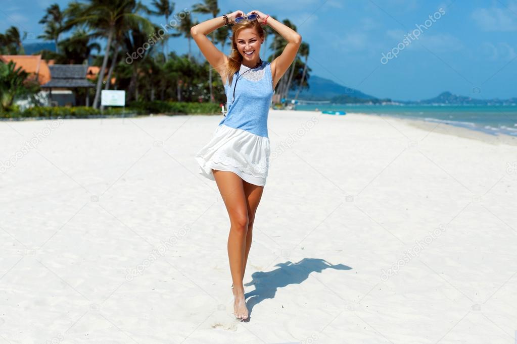 young woman having fun on the beach