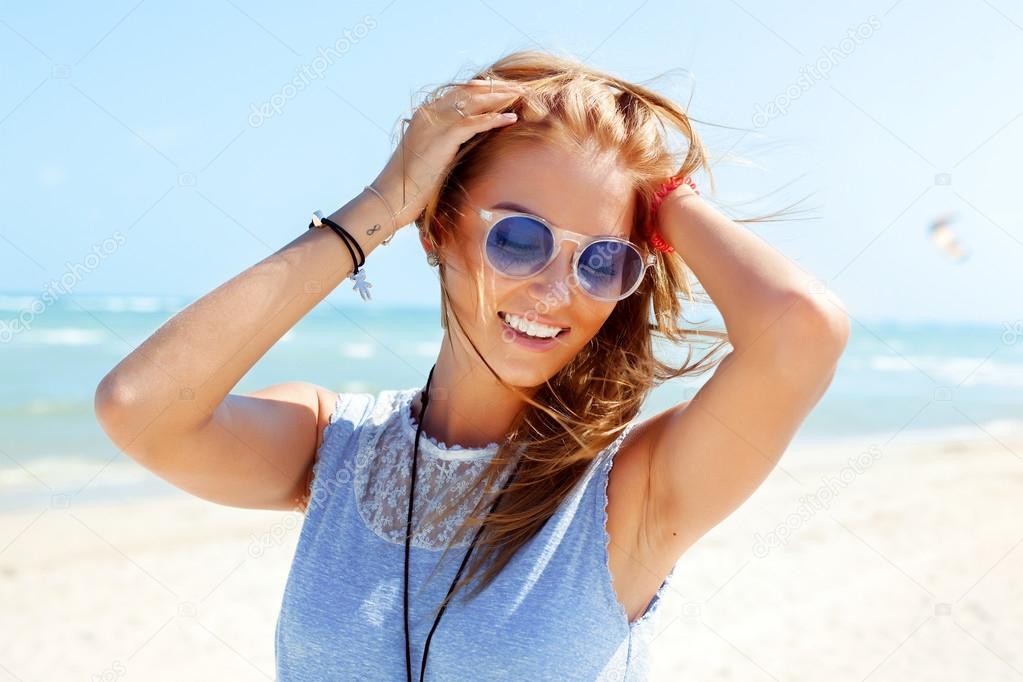 smiling tanned woman  on the beach